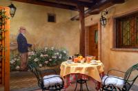a painting of a man standing next to a table at Hotel Santa Maria in Rome