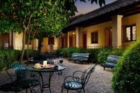 a patio with chairs and a table with food on it at Hotel Santa Maria in Rome