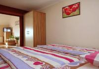 Posteľ alebo postele v izbe v ubytovaní Hellasz Apartman