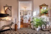 a living room with a table in the distance at Le Pavillon des Lys - Hôtel Particulier in Amboise