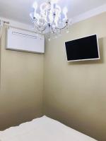 Televízia a/alebo spoločenská miestnosť v ubytovaní Castelvecchio Loft