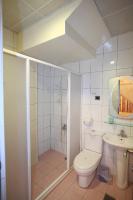 a bathroom with a toilet and a sink at Cruise Homestay in Hualien City