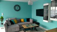 Televízia a/alebo spoločenská miestnosť v ubytovaní Apartament Holiday 32