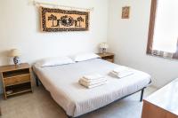 A bed or beds in a room at Casetta Delle Allodole