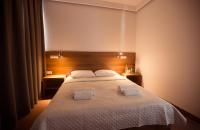 Posteľ alebo postele v izbe v ubytovaní Hotel Rubin