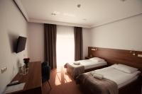 Posteľ alebo postele v izbe v ubytovaní Hotel Rubin
