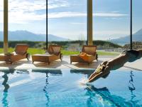 a dolphin jumping out of a swimming pool at Wellnesshotel Linde in Sulzberg