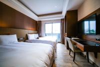 Talmud Hotel Tainanにあるベッド