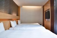 Talmud Hotel Tainanにあるベッド