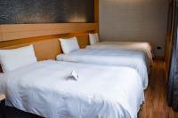 Talmud Hotel Tainanにあるベッド