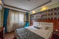 Postel nebo postele na pokoji v ubytování Madi otel