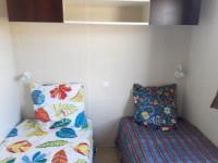 a room with a bed and a pillow in a room at Propriete de 2 chambres avec piscine partagee terrasse amenagee et wifi a Vic la Gardiole a 4 km de la plage in Vic-la-Gardiole