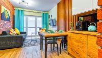 Televízia a/alebo spoločenská miestnosť v ubytovaní Apartament Biały Wilk - 5D Apartamenty