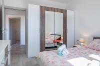 Postel nebo postele na pokoji v ubytování Kaylie Apartment