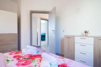 Postel nebo postele na pokoji v ubytování Kaylie Apartment