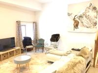 a living room with a couch and chairs at Appartement de 4 chambres avec jardin clos et wifi a Le Monetier les Bains in Le Monêtier-les-Bains
