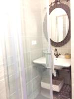 a bathroom with a sink and a mirror at Appartement de 4 chambres avec jardin clos et wifi a Le Monetier les Bains in Le Monêtier-les-Bains