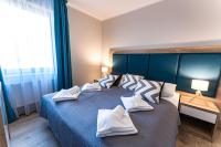 Łóżko lub łóżka w pokoju w obiekcie Apartamenty Bawaria