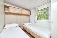 Posteľ alebo postele v izbe v ubytovaní Camping Stella Maris Mobile Homes
