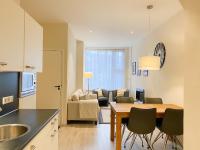 a kitchen and living room with a table and chairs at Vakantiehuis in het Centrum van Domburg DO19 in Domburg