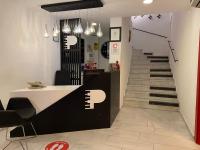 a lobby with a staircase and a stair case at Piano Hotel in İzmir