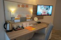 TV a/nebo společenská místnost v ubytování Park Hotel Odessos - All Inclusive