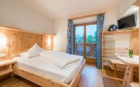 Posteľ alebo postele v izbe v ubytovaní Hotel Jonathan