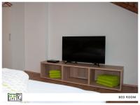 A television and/or entertainment centre at ACO Living - A cool Overnight