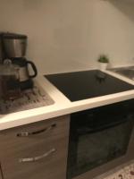 a kitchen with a counter top with a coffee maker at Les Coulisses de l&#39;HORLOGE - WIFI - 50 m Palais des Papes in Avignon