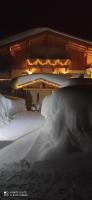 a bed covered in snow in a room at Chalet Heidi in Kartitsch