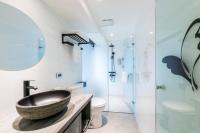 a bathroom with a sink and a toilet and a mirror at RF Hotel - Zhongxiao in Taipei
