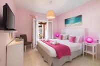 Posteľ alebo postele v izbe v ubytovaní Garden Apartments Agios Stefanos Corfu