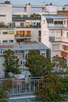 a view of a city with a table and chairs at Hotel Eiffel Blomet in Paris