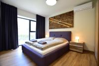 Posteľ alebo postele v izbe v ubytovaní Apartamenty Minimal House