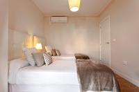 Posteľ alebo postele v izbe v ubytovaní Exclusive Apartments Plaza Merced