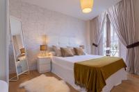 Posteľ alebo postele v izbe v ubytovaní Exclusive Apartments Plaza Merced