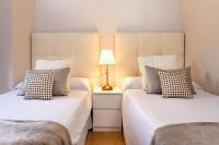 Posteľ alebo postele v izbe v ubytovaní Exclusive Apartments Plaza Merced
