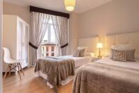 Posteľ alebo postele v izbe v ubytovaní Exclusive Apartments Plaza Merced