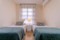 Posteľ alebo postele v izbe v ubytovaní Exclusive Apartments Plaza Merced