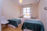 Posteľ alebo postele v izbe v ubytovaní Exclusive Apartments Plaza Merced
