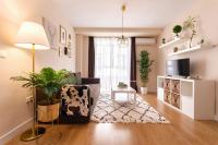 Televízia a/alebo spoločenská miestnosť v ubytovaní Exclusive Apartments Plaza Merced