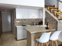 Kuchyň nebo kuchyňský kout v ubytování Cozy Loft Apartment 2