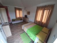Katil atau katil-katil dalam bilik di Termalna Rivijera Apartmani