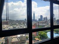 a view from a window of a city at Capital Hotel SongShan in Taipei