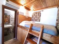 Posteľ alebo postele v izbe v ubytovaní Rustic House
