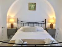 A bed or beds in a room at Anthos House