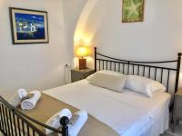 A bed or beds in a room at Anthos House