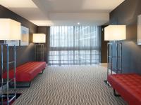 a hotel room with two red benches and a window at Lutecia Smart Design Hotel in Lisbon