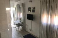 Televízia a/alebo spoločenská miestnosť v ubytovaní Mar&Mar, apartamento con solárium y piscina