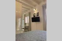 Televízia a/alebo spoločenská miestnosť v ubytovaní Mar&Mar, apartamento con solárium y piscina